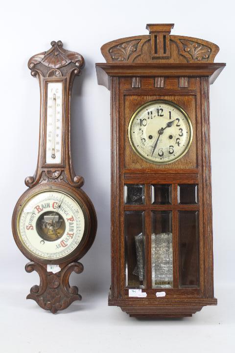 An oak cased HAC wall clock with key and