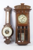 An oak cased HAC wall clock with key and