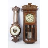 An oak cased HAC wall clock with key and