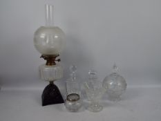 Lot to include a vintage oil lamp and a quantity of glassware including decanters.