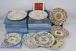 A collection of Wedgwood calendar plates, predominantly boxed.