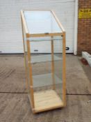 A pine framed display cabinet with glass shelves, approximately 137 cm x 46 cm x 48.