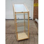 A pine framed display cabinet with glass shelves, approximately 137 cm x 46 cm x 48.