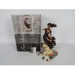 A boxed Regency Fine Arts figurine entitled Guidance, approximately 31 cm (h).