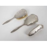 A silver backed, three piece, dressing table set, Birmingham assay,