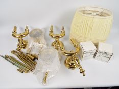 A collection of brass wall lights.