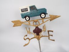 A cast iron, wall mountable, weather vane with Land Rover surmount. XWVLW.