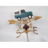 A cast iron, wall mountable, weather vane with Land Rover surmount. XWVLW.