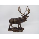 A bronzed, cast iron, model of a stag, approximately 43 cm (h). XSTAN.