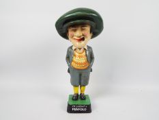 A replica, cast iron, advertising figure for Penfold Golf, He Played A Penfold,