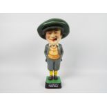 A replica, cast iron, advertising figure for Penfold Golf, He Played A Penfold,