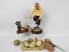 Lot to include onyx ornaments, vintage pipe and pipe stand and a golfing figure,
