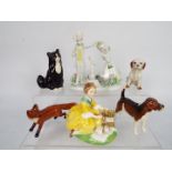 A mixed lot of figures to include Beswick fox and hound,