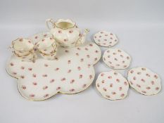 A quantity of Wileman & Co tea wares, pattern 7447, comprising lobed tray, teapot (lacking cover),