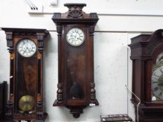 A dark wood Vienna style wall clock,