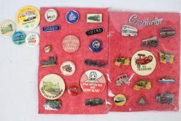 A collection of vintage pin badges,