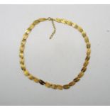 A 9ct yellow gold necklace with alternating textured links, London import marks, 41 cm (l),