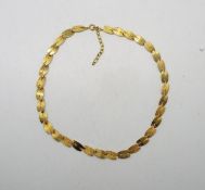 A 9ct yellow gold necklace with alternating textured links, London import marks, 41 cm (l),