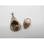 A 9ct gold stone set pendant and a rose metal heart padlock clasp, approximately 3.7 grams.