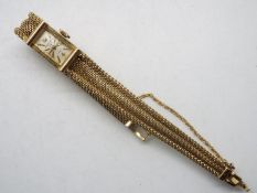 Baume & Mercier - A lady's mid-purity yellow metal wrist watch and bracelet, stamped 14k,