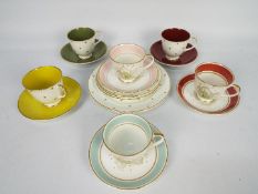 Susie Cooper - A collection of tea wares to include three Magnolia pattern tea cups and saucers and