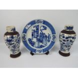 A pair of Nanking blue and white, crackle glaze vases with oxidised bands to the foot and shoulder,