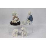 Lladro - Four figures comprising a seated Buddhist monk with bowl,