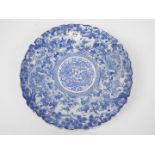 A blue and white shallow dish with shaped rim,