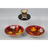 Two Poole Pottery Delphis bowls, shape 56, decorator's mark for Gillian Taylor on one,