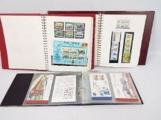 Philately - A collection of Isle Of Man mint stamps and stamp booklets spread over three albums /