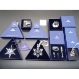 Swarovski Crystal - six boxed crystal figures / sculptures to include two Christmas star ornaments,