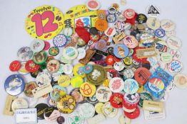 A quantity of vintage pin badges, various themes.