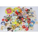 A quantity of vintage pin badges, various themes.