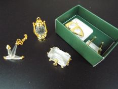 Swarovski Crystal Memories - four crystal miniatures comprising an Anchor, a Treasure Chest,