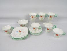 A collection of Shelley floral decorated tea wares, twenty pieces.