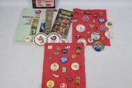 A collection of vintage pin badges / patches relating to sport / Manchester United / Olympics