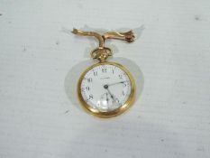 A mid-purity yellow metal cased fob watch, the case stamped 14k 585 Fine,
