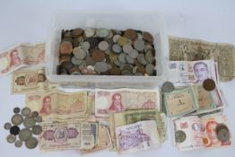 A collection of UK and foreign coins and banknotes, some silver content noted.