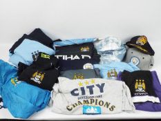Manchester City Football Club - A collection of Manchester City branded clothing, hats, shirts,