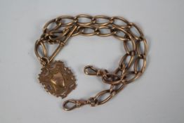 A 9ct rose gold watch chain with T-bar and a rose metal fob, stamped 9c, chain 38 cm (l),