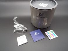 Swarovski Crystal - a Dolphin with Wave stand, boxed with internal packaging,
