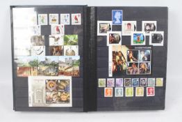 Philately - A binder of GB mint stamps, approximately £500 face value.