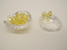 Swarovski Crystal - a Lidded Trinket Box containing a quantity of yellow tinted heart-shaped