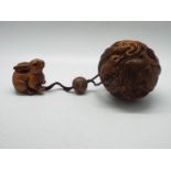A single case, carved hardwood, Zodiac inro of spherical form,