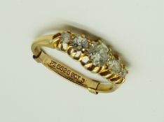A lady's hallmarked 18 carat yellow gold ring set with five old brilliant cut diamonds estimated to