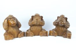 Sambiki Saru - Three large wooden carvings of the three wise monkeys, approximately 27 cm (h).