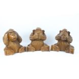Sambiki Saru - Three large wooden carvings of the three wise monkeys, approximately 27 cm (h).