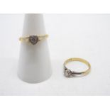 18ct Gold - An 18ct gold ring with single clear stone in a heart shaped setting,