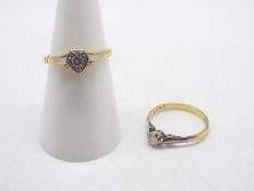 18ct Gold - An 18ct gold ring with single clear stone in a heart shaped setting,
