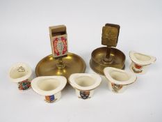 A trench art matchbox holder, one other matchbox holder and five crested ware top hats.